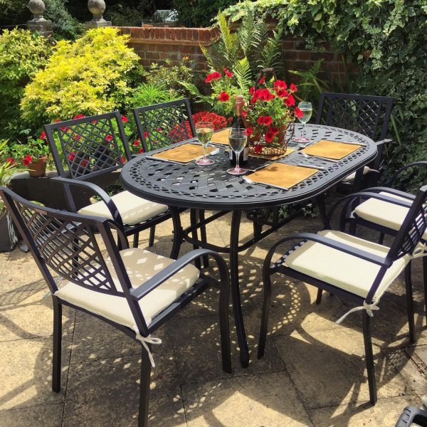 Customer photo of the June 6 seater garden table and Jane chairs in antique bronze with stone cushions